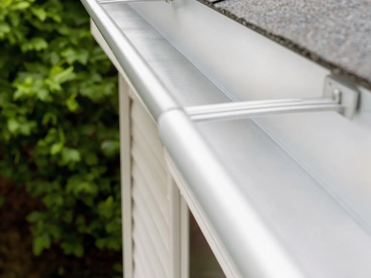 Close view of a clean residential gutter, clear of leaves and debris